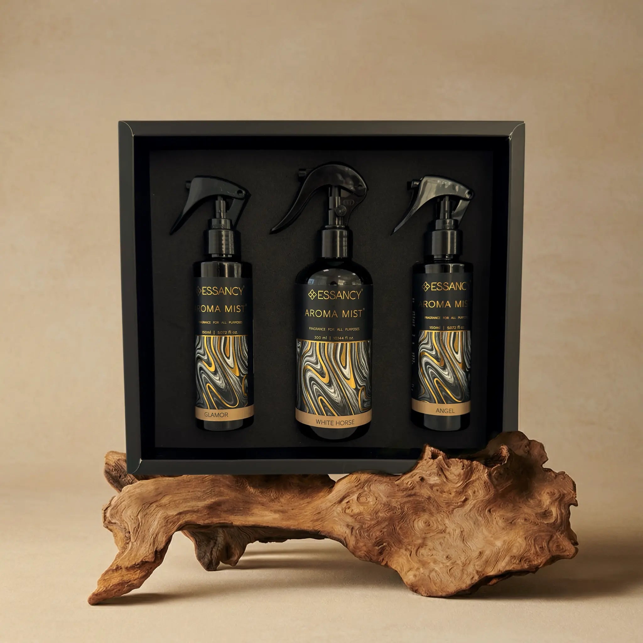 Luxurious aroma mist gift box with three elegant spray bottles.