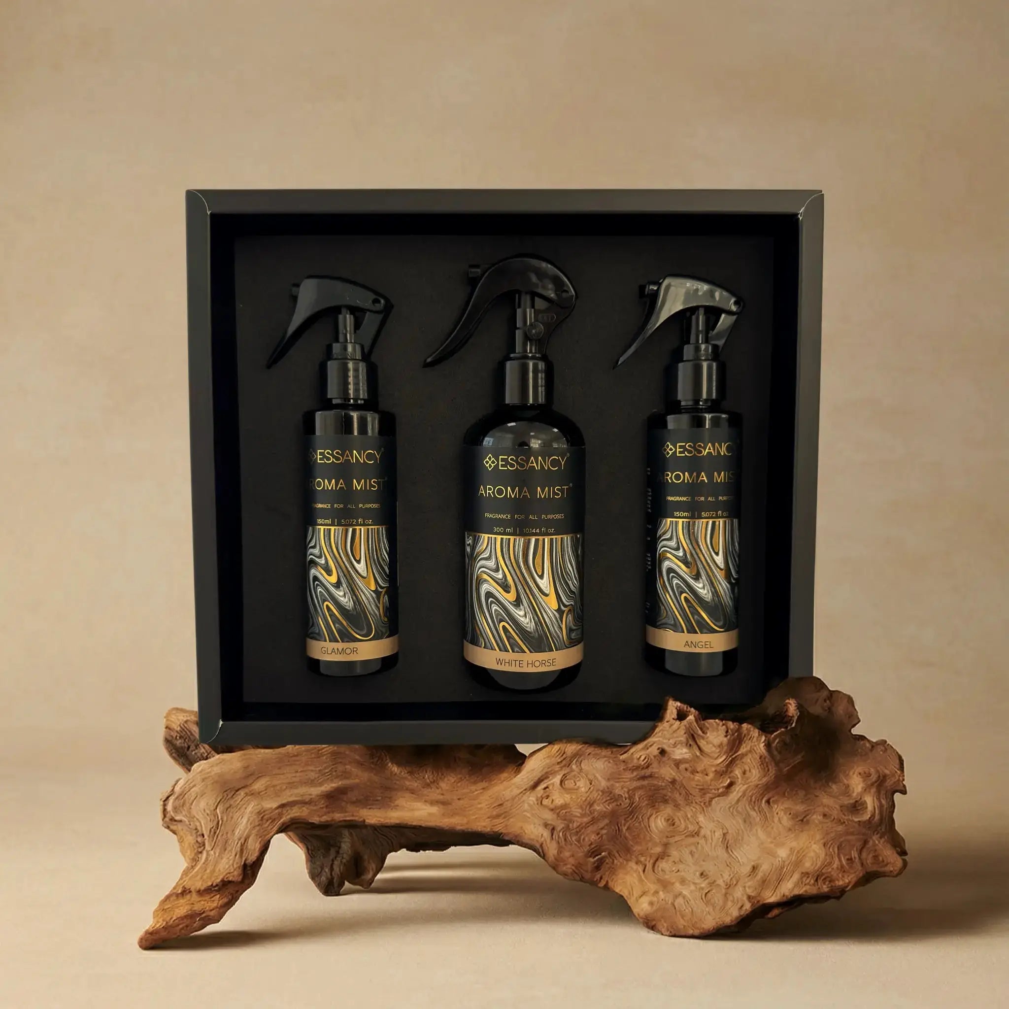 Luxury Home Aroma Spray Set with three elegant mist bottles in a black gift box, displayed on a decorative wooden base for home fragrance decor.
