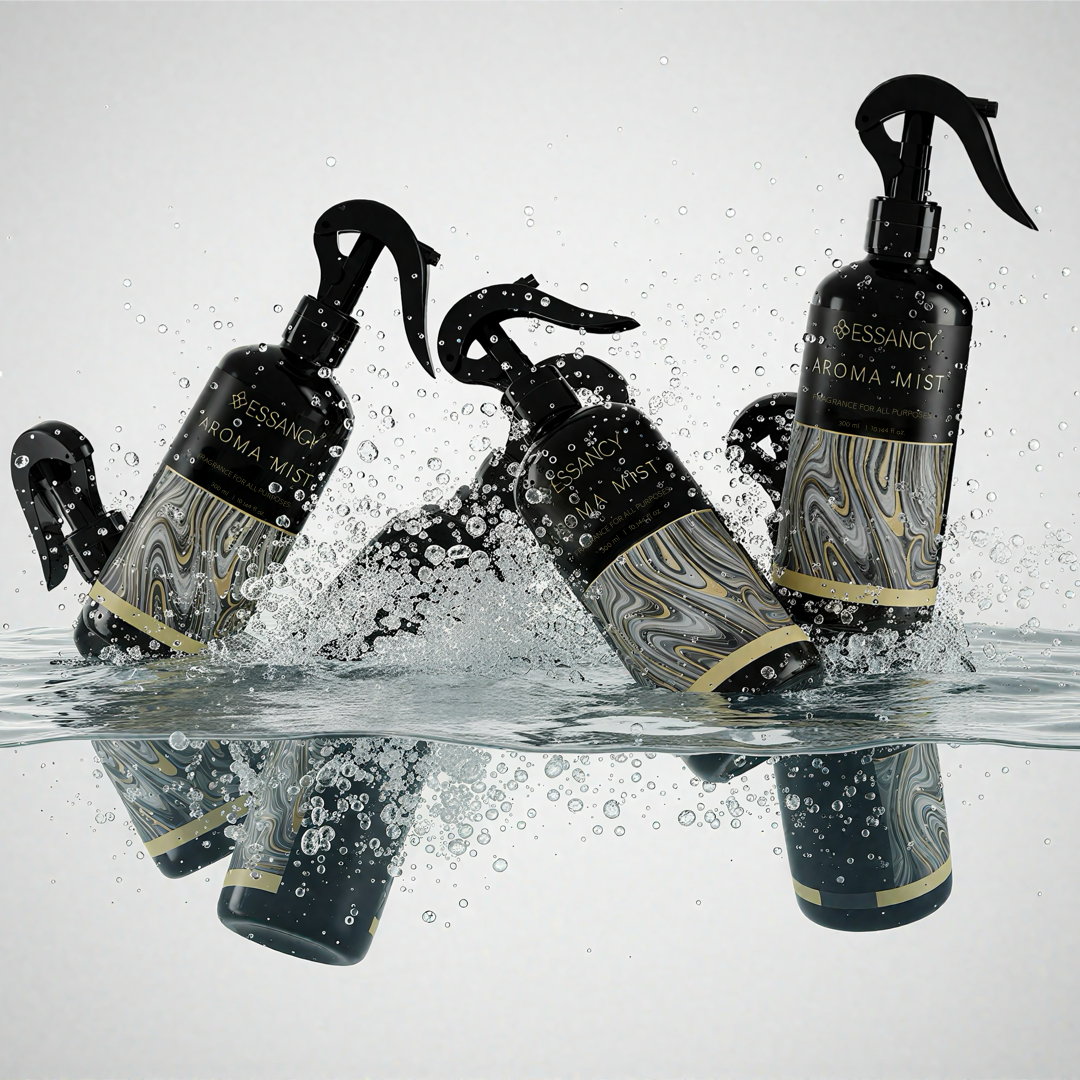 Bessancy Aroma Mist bottles with marbled design and gold accents on a reflective water surface.